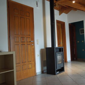 Apartment door and Sweden stove in the living room